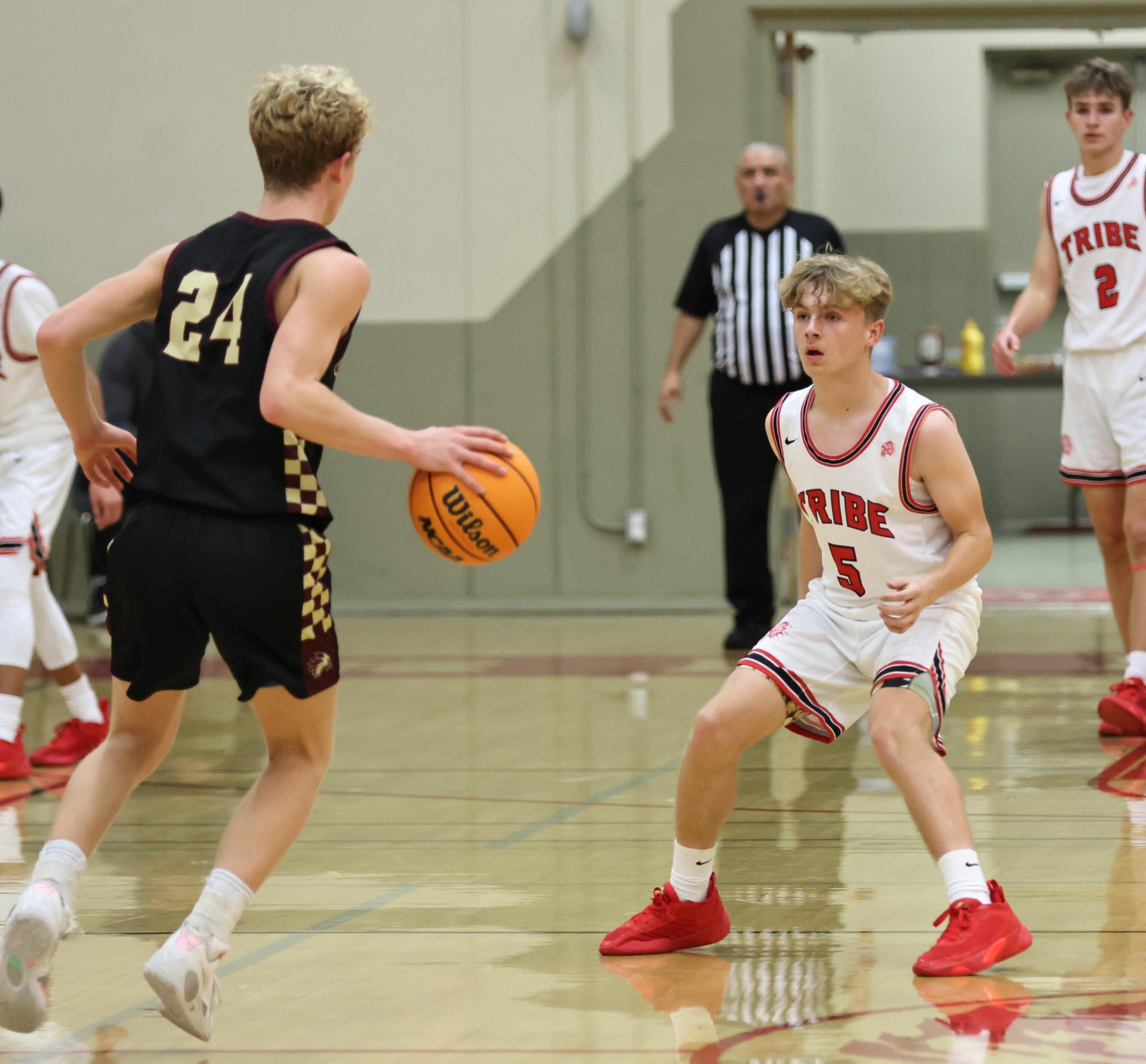 varsity boys basketball playing against sierra