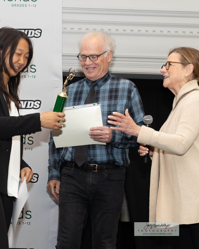 Student Receiving award from Coach