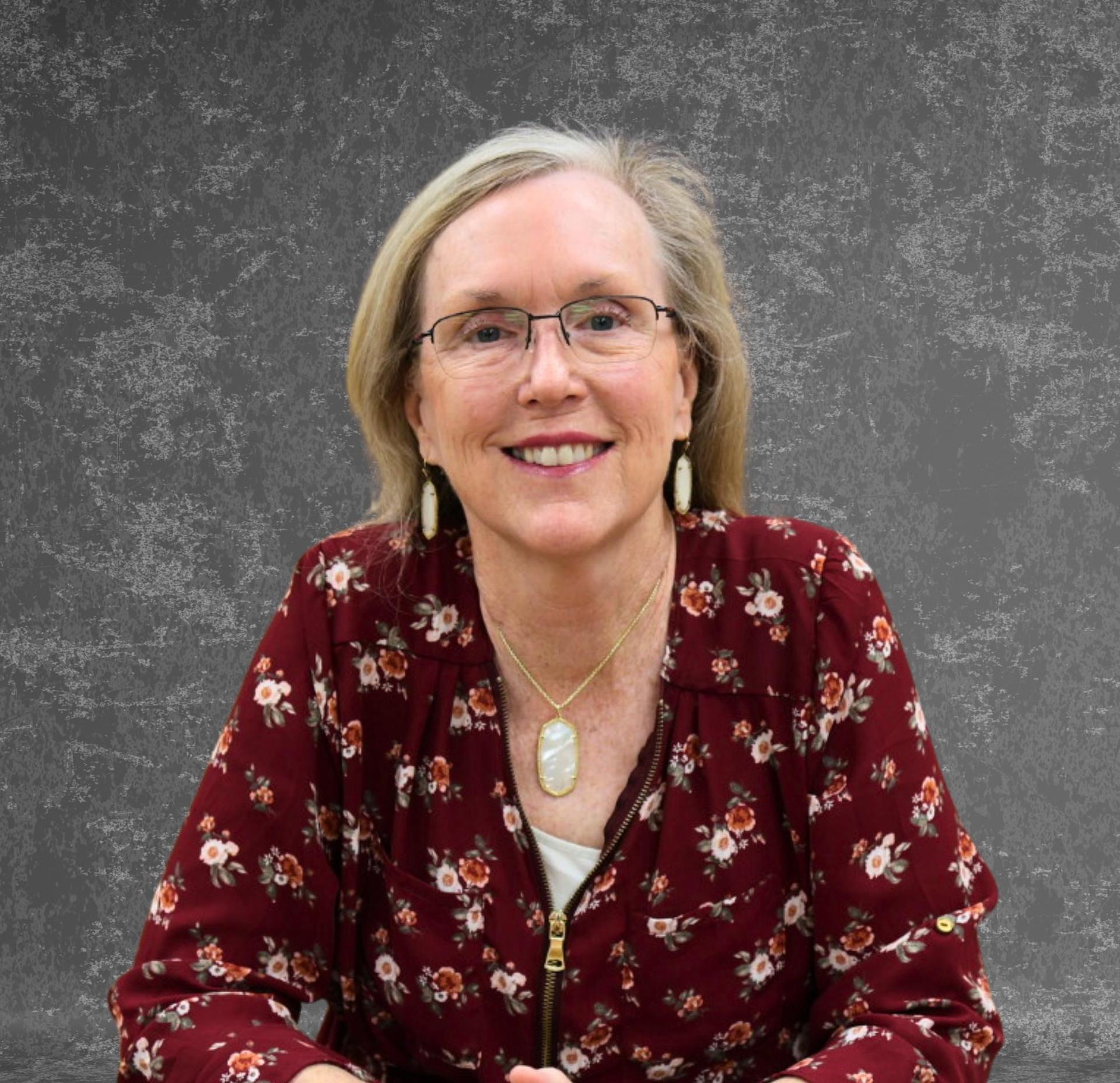 gray background image of debra martinez board member