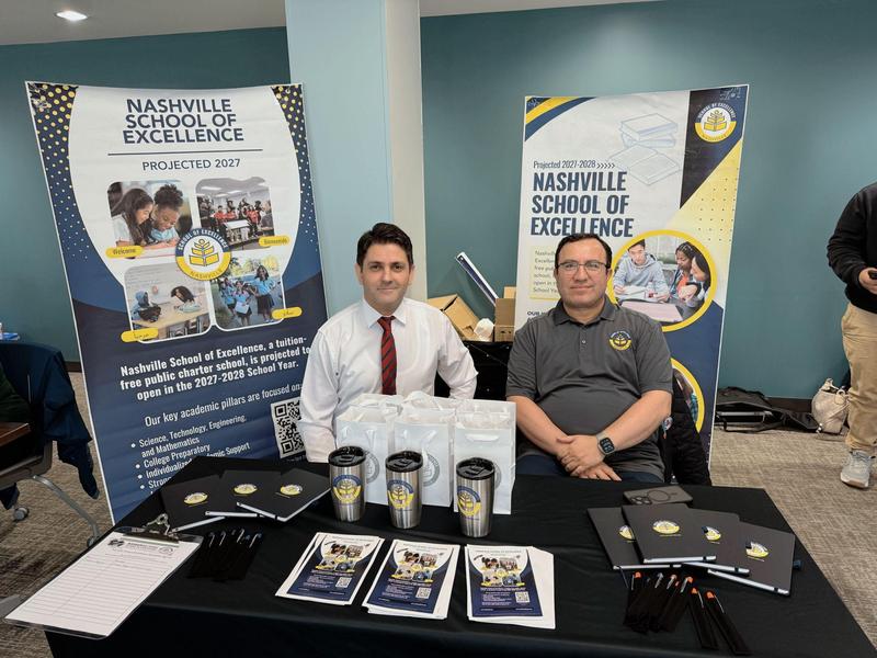 Nashville School of Excellence representatives at an informational booth during a community event