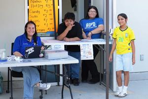 Teacher and ASB students selling snacks