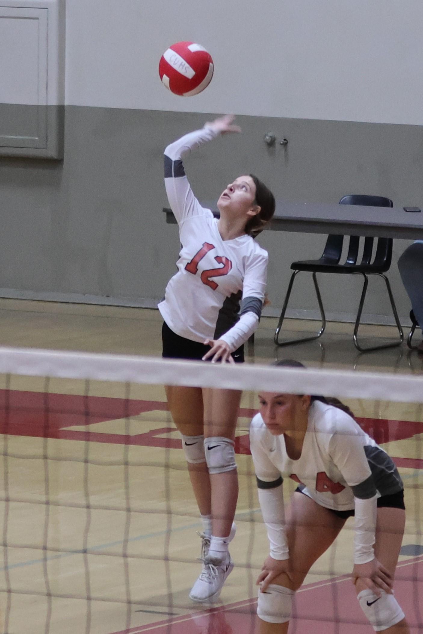 junior varsity girls playing volleyball 88