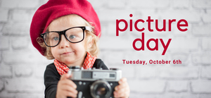 girl wearing red hat with camera