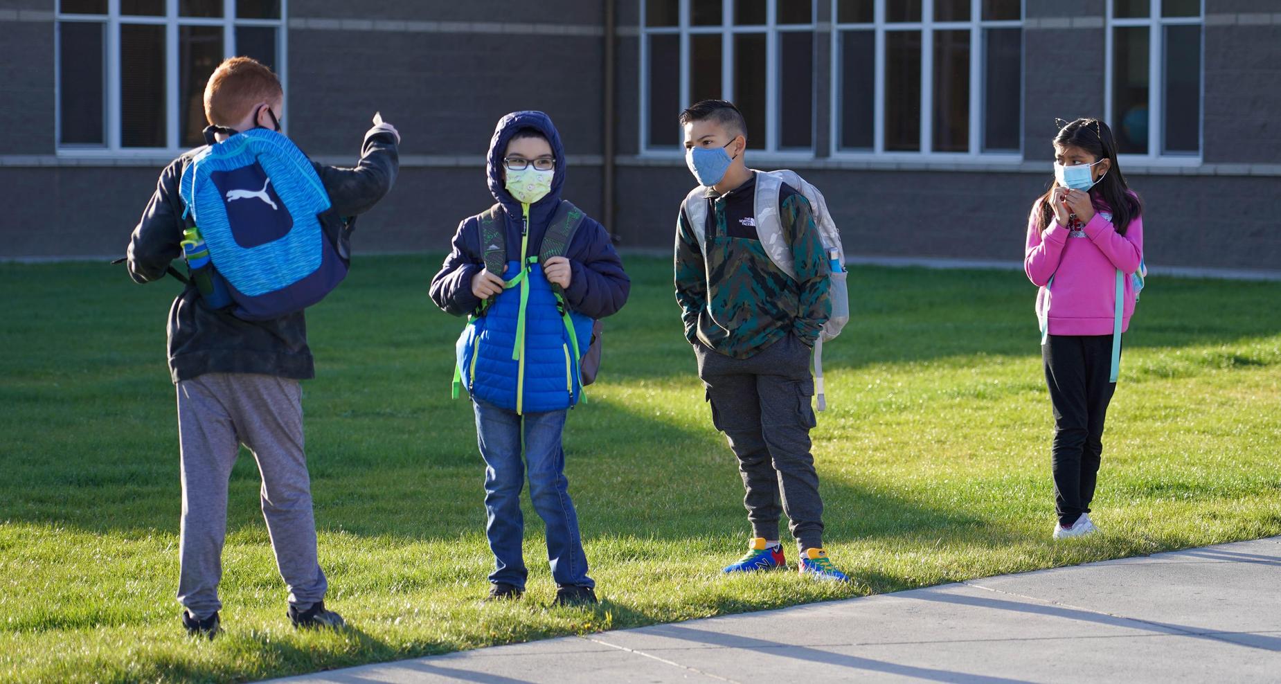 Boy providing directions to his peers.
