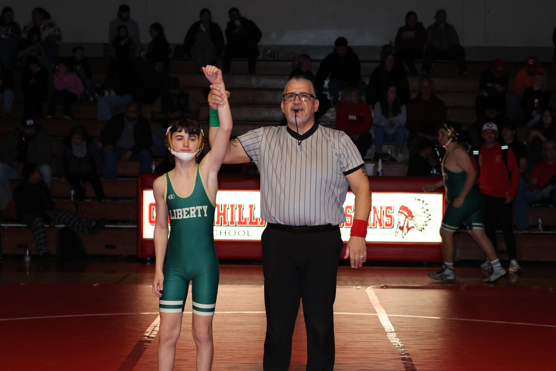 Wrestling winners with hands up 80