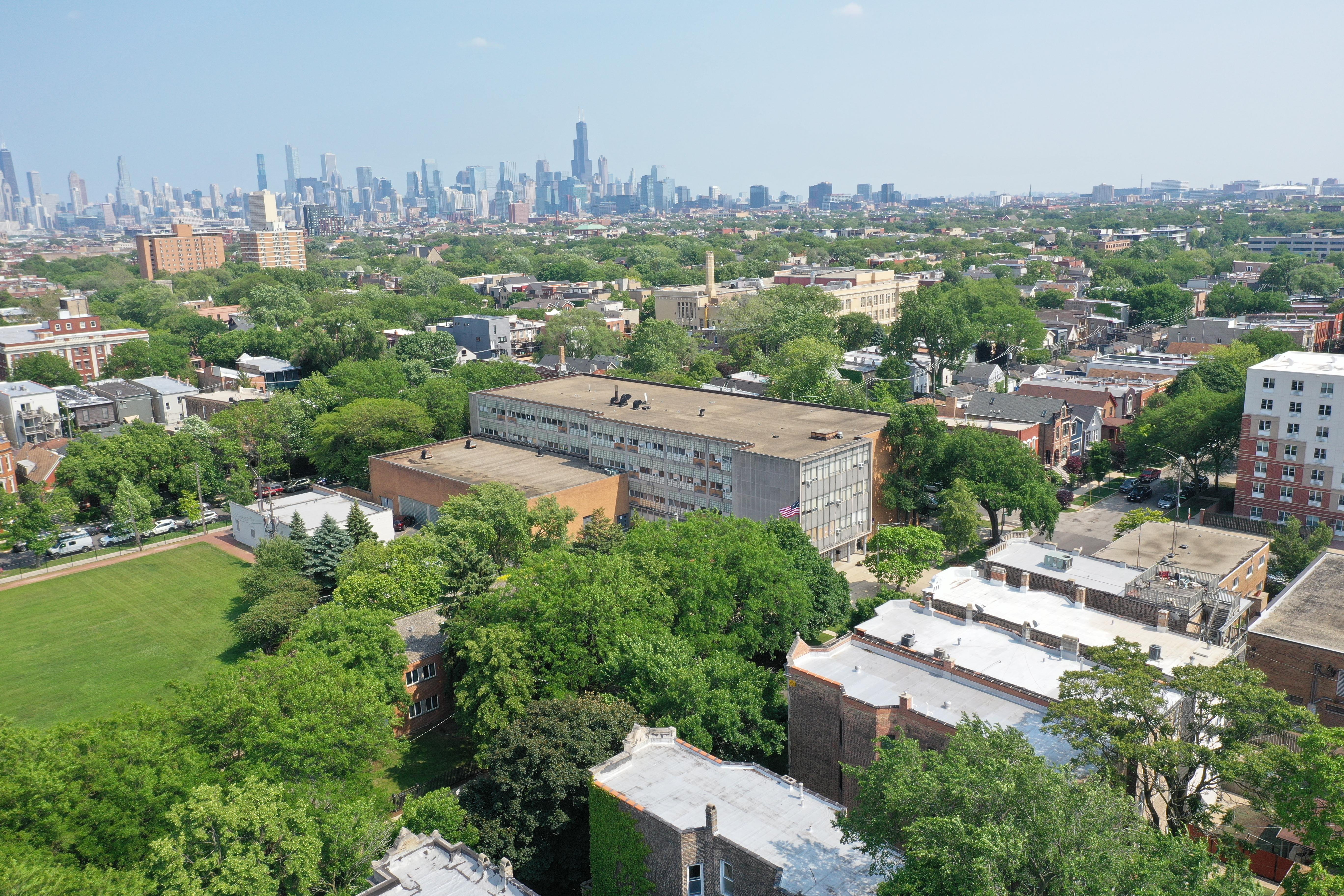 Arial view of the school with city background