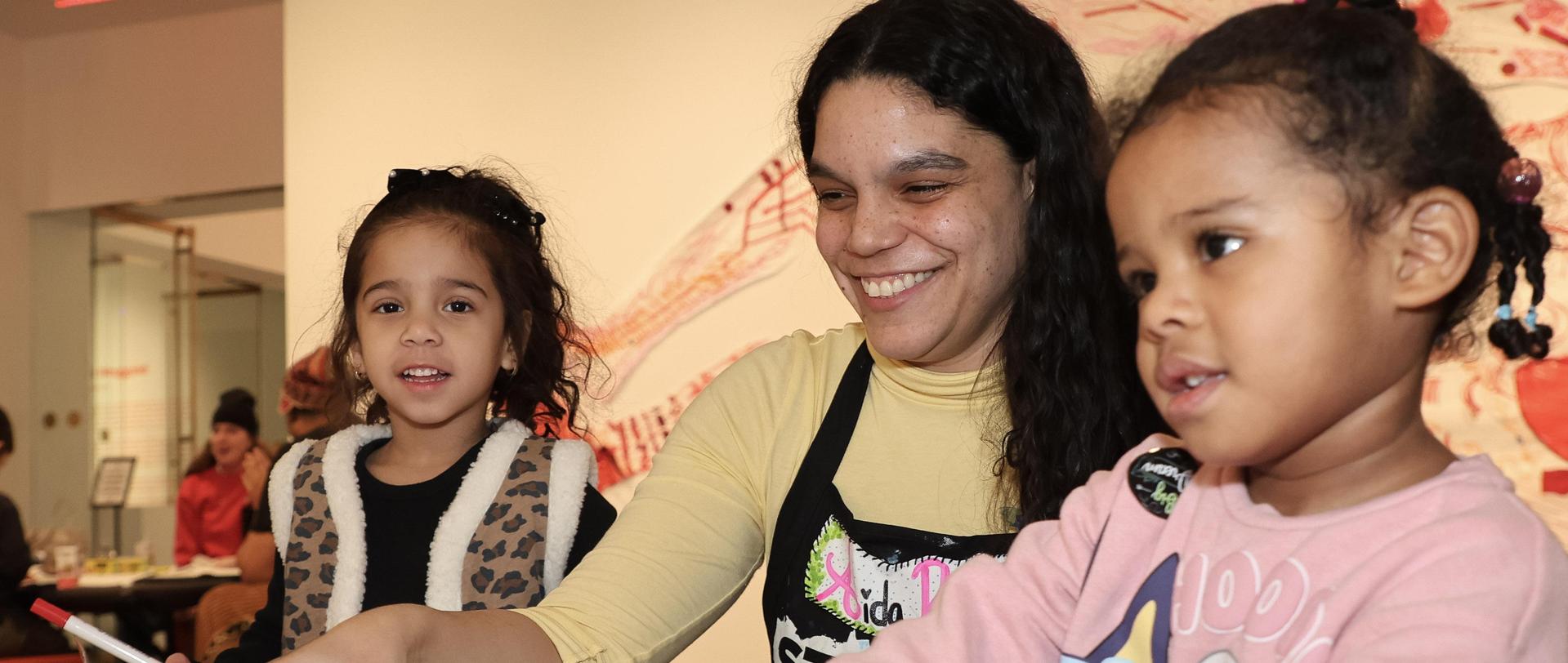 Children making art with teacher