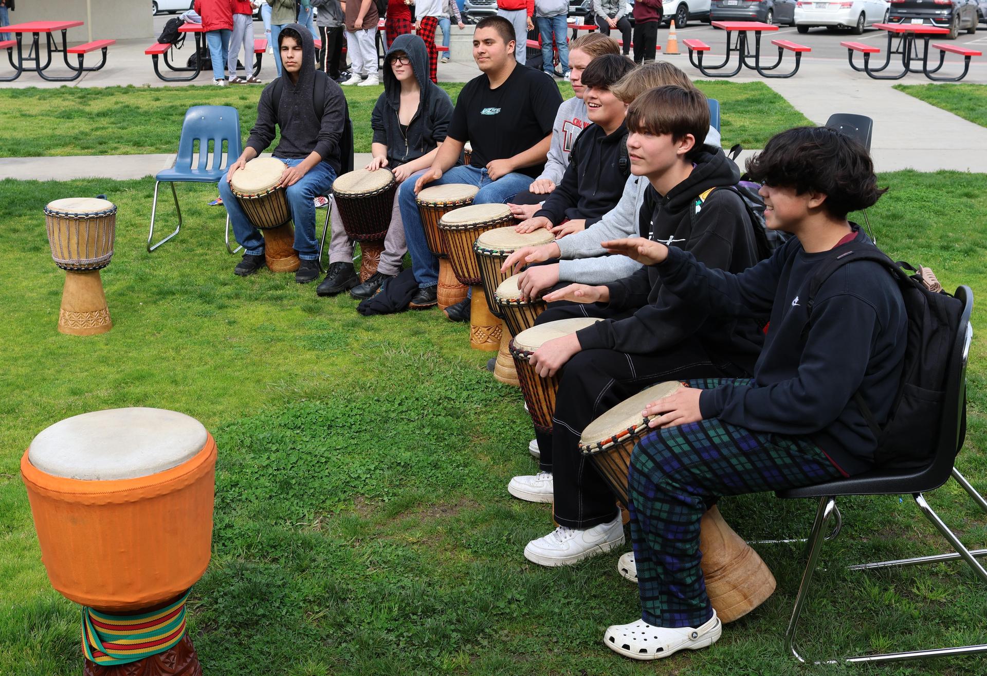 students and staff participating with the African Drum Interactive