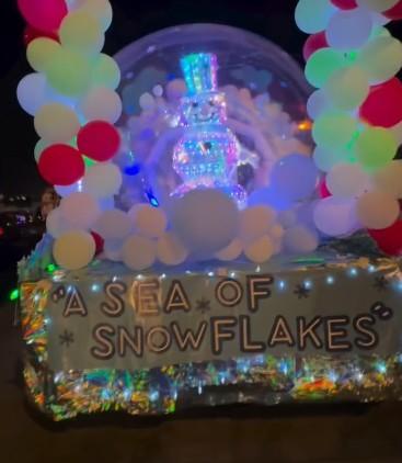a parade float features a snowman