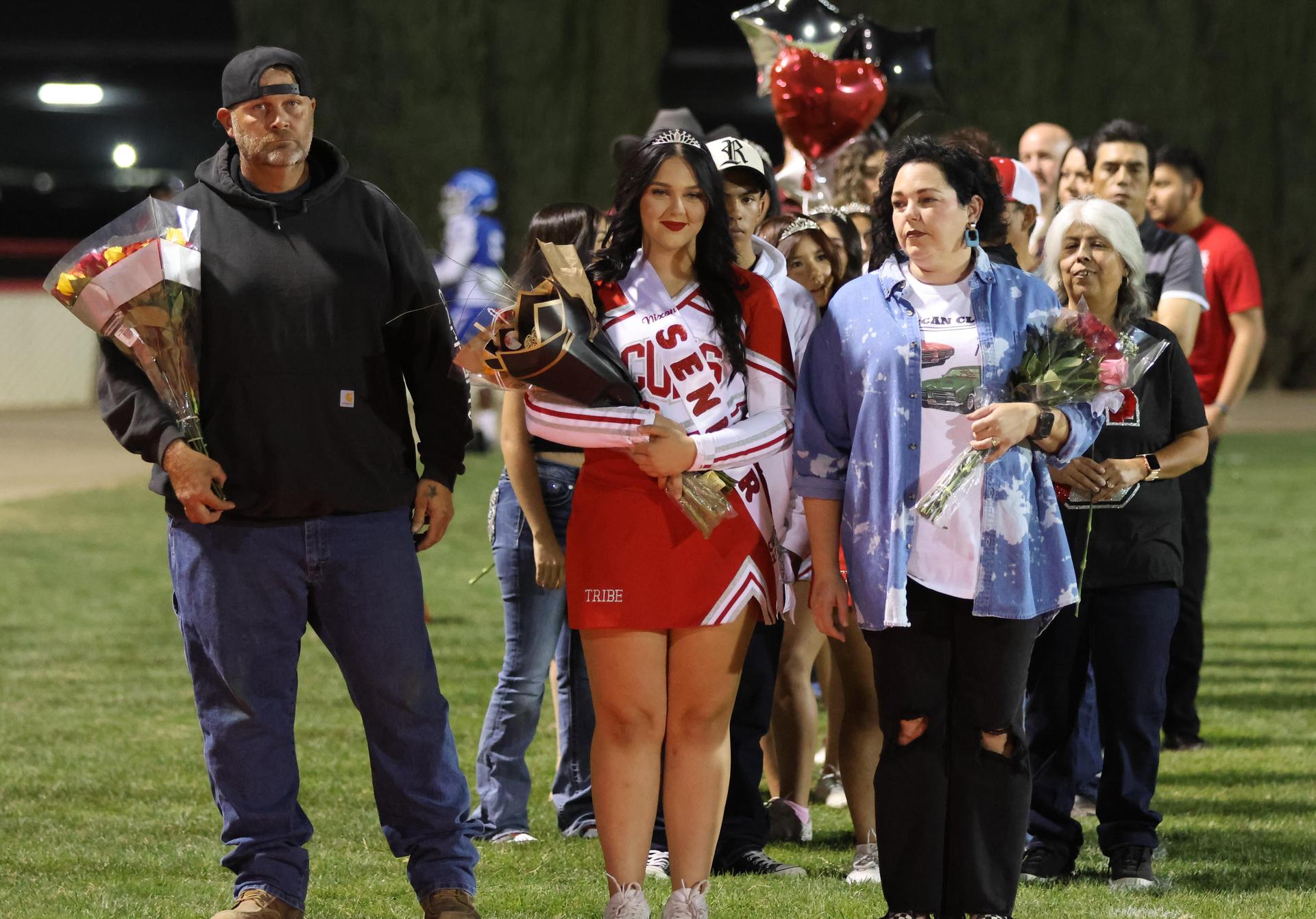 seniors and their escorts celebrating senior night
