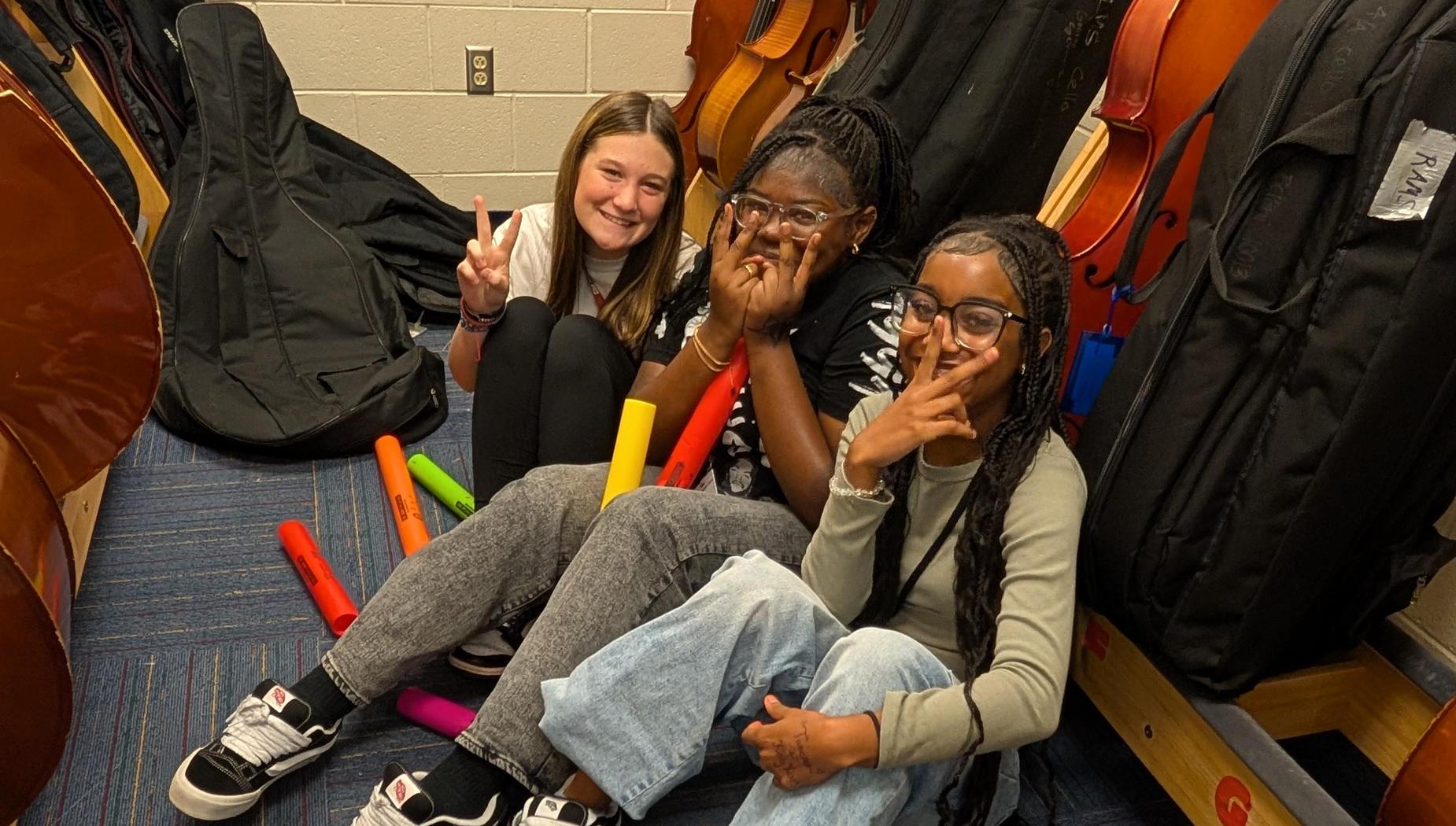 Creative music students posing between practicing rhythms