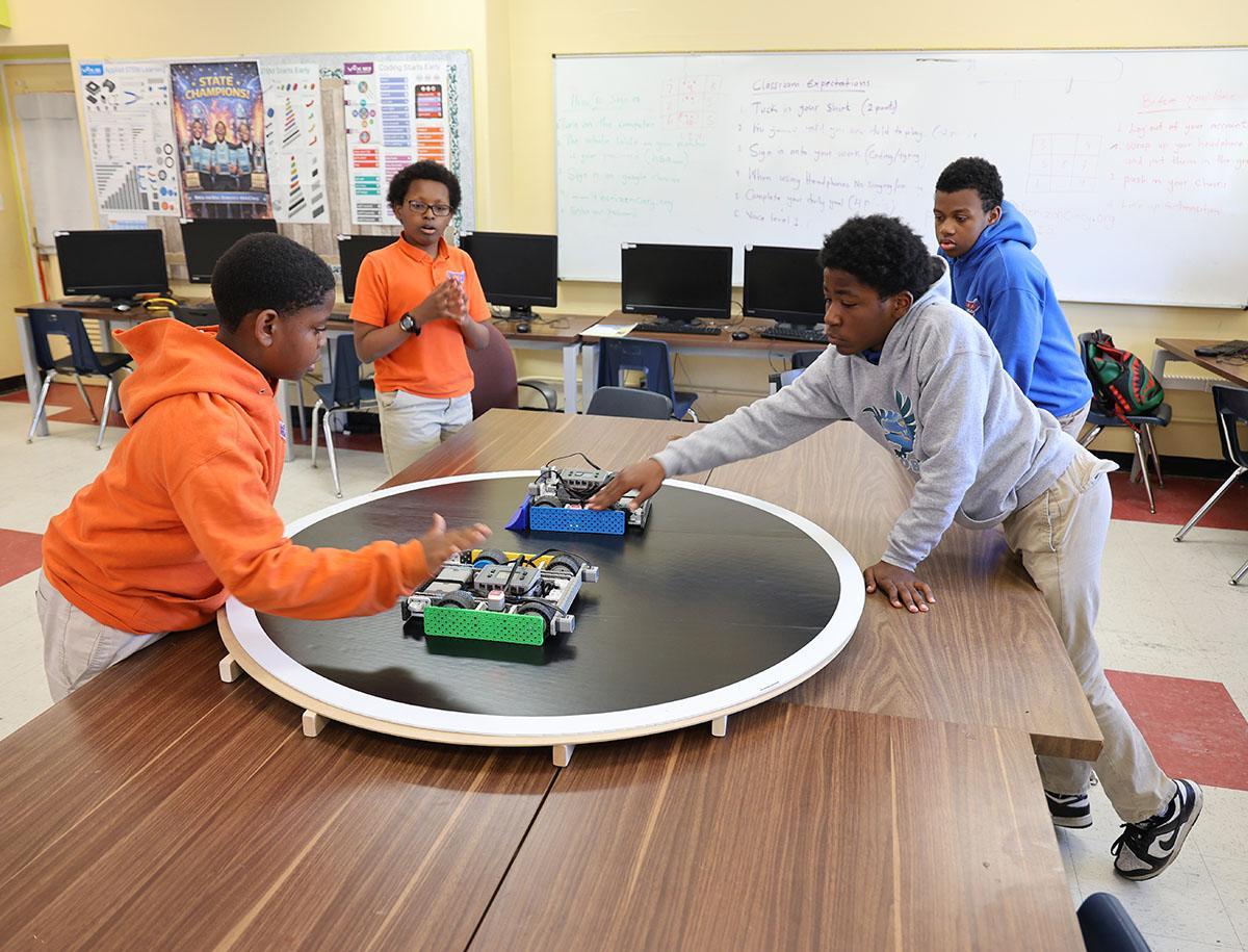 HSA Cincinnati students working with robots