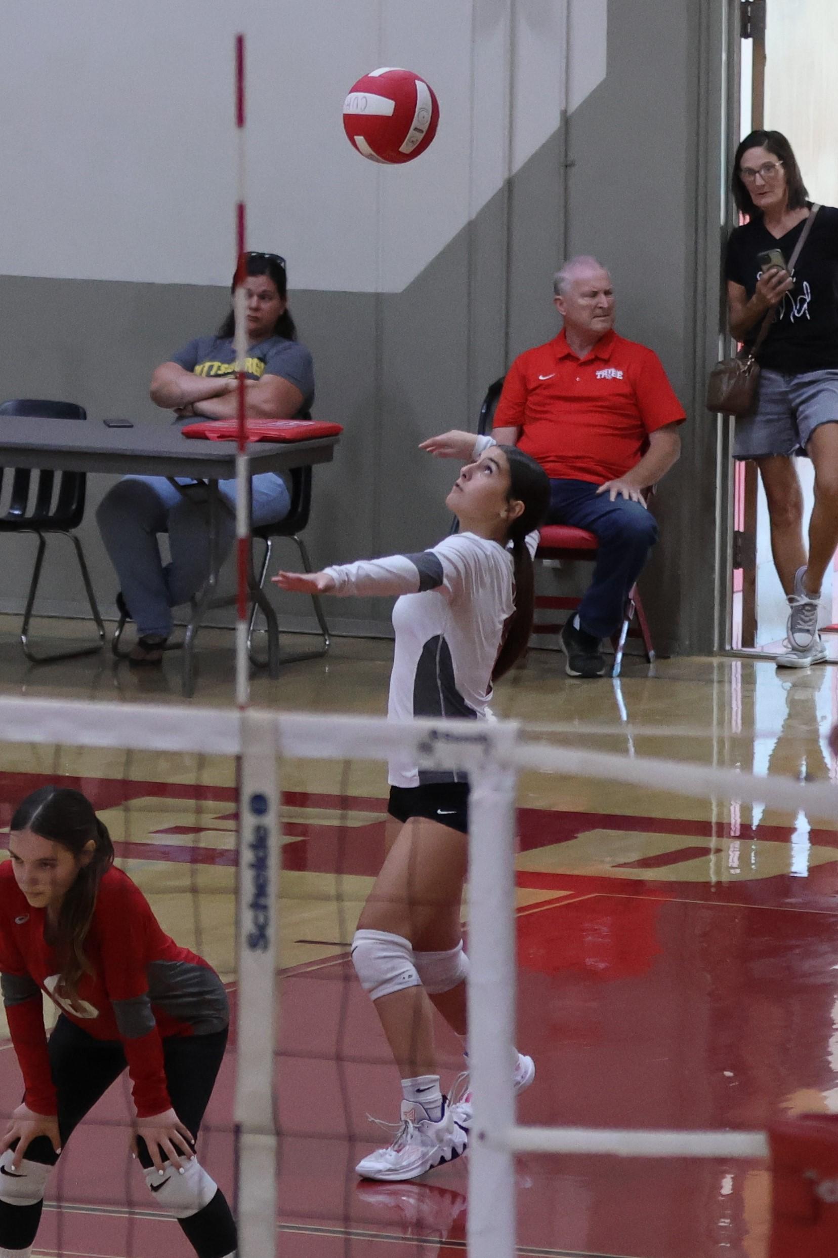 junior varsity girls playing volleyball 78