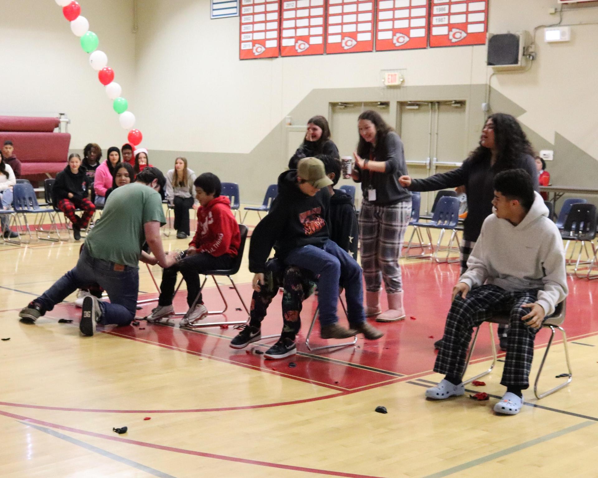 students playing the balloon pop game