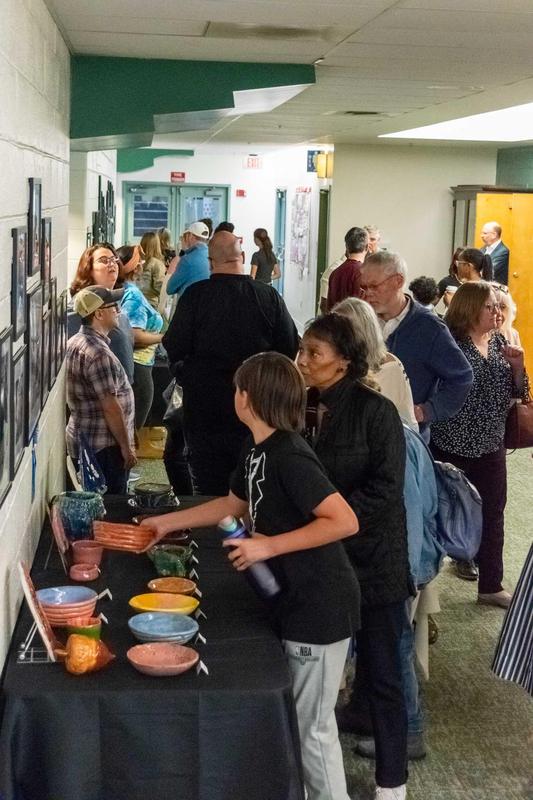 Crowd enjoying artwork in the gallery