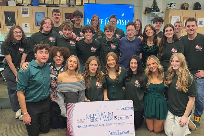 The PTTV crew displays the final total raised during the 2025 telethon, $66,415