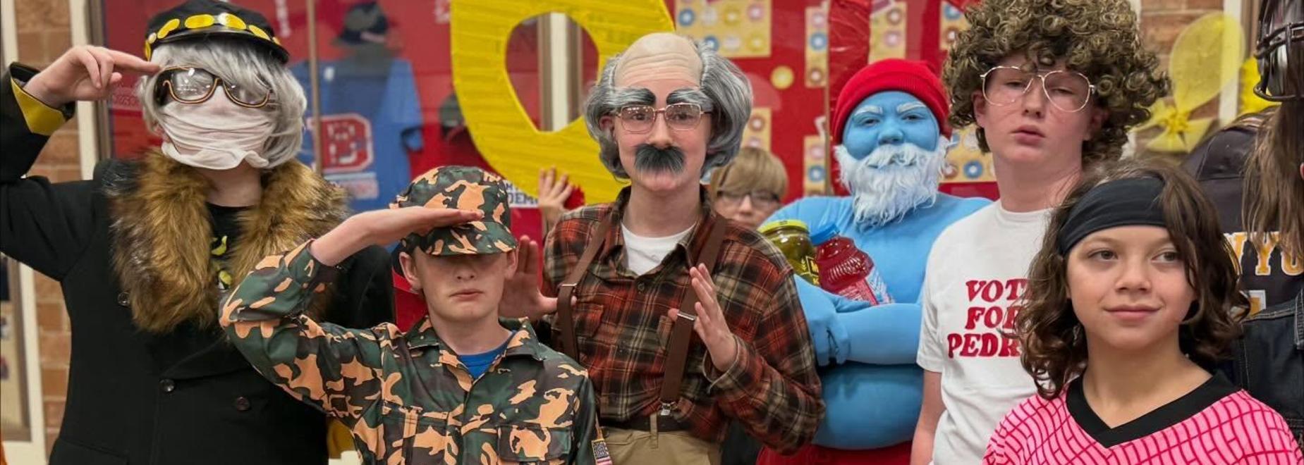 Kids in various costumes, including military, plaid, and ghost outfits, striking fun poses.