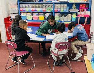 BHS Student sitting with Davis students