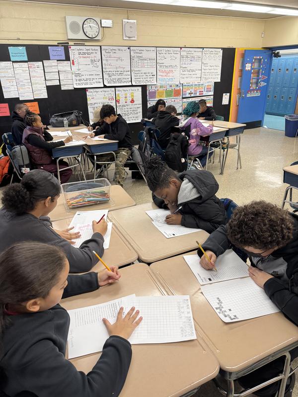 Middle school students working