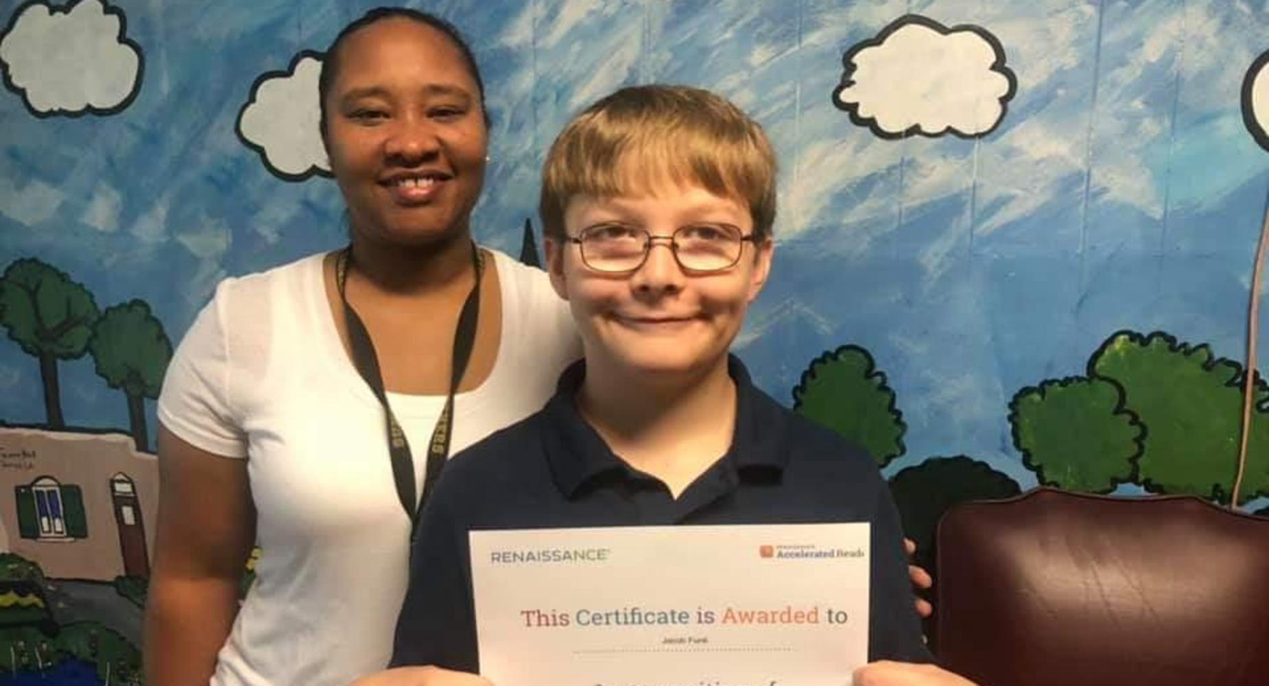ACCELERATED READER STUDENT OF THE WEEK PICTURED WITH MRS. HUNT