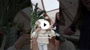A YouTube thumbnail showing a student in a Grow Dome giving the camera two thumbs up