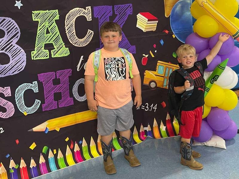 students pose at a back-to-school display at RES
