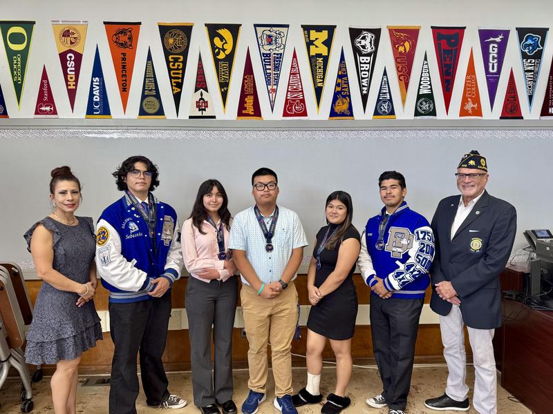 BPHS College & Career Advisor Lupe Falls, student Sebastian Camacho, Anais Markes, Justin Vo, Dixianah Cervantes, Oscar Alfaro, and Veteran Advisor Agustin Jimenez take a group photos at Baldwin Park High