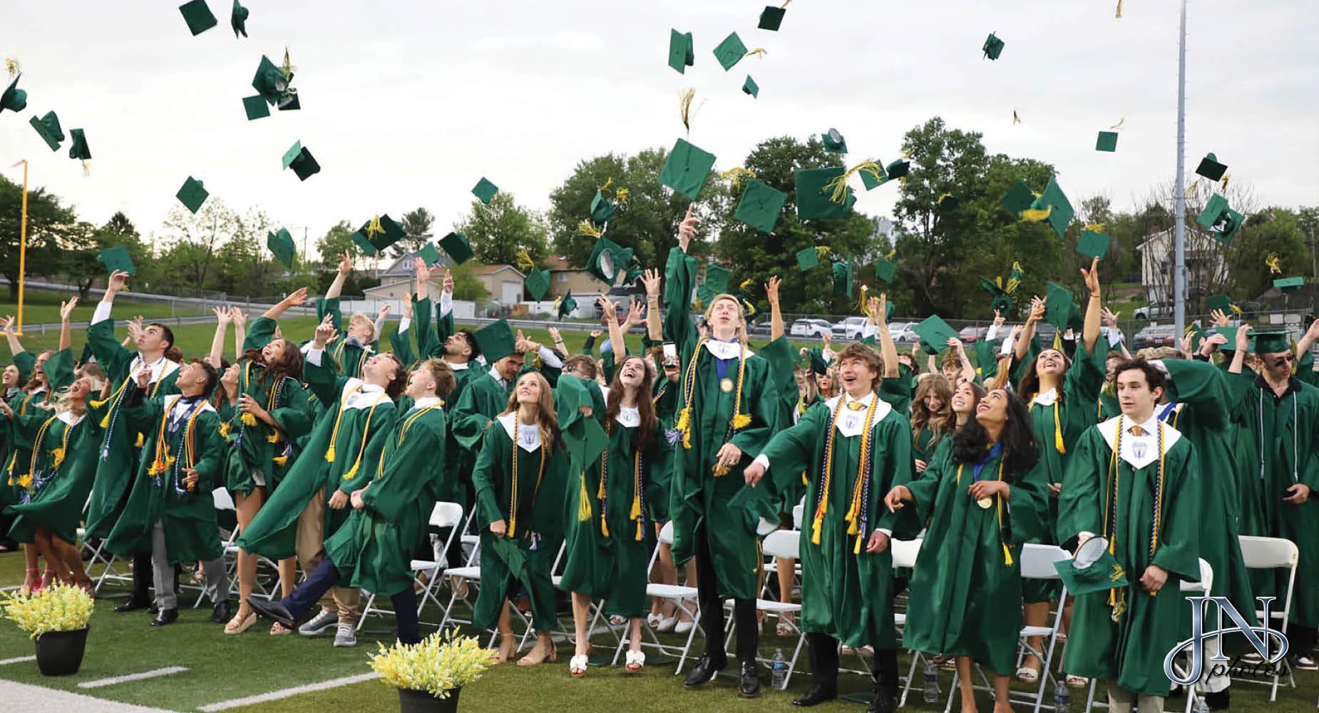 Class of 2026 graduation ceremony during the moment the students toss their graduation caps in the air