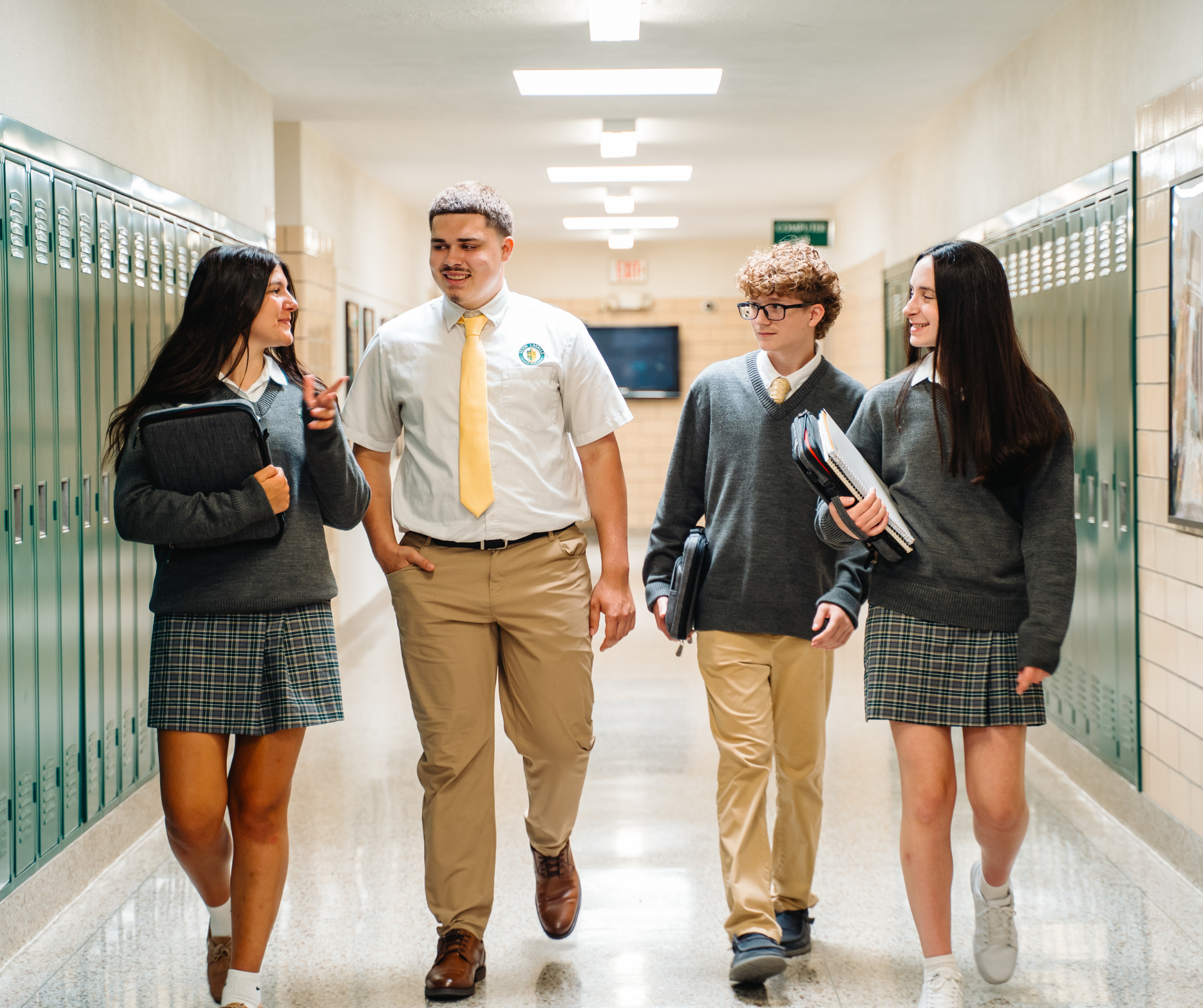 Students laugh together in the hallway