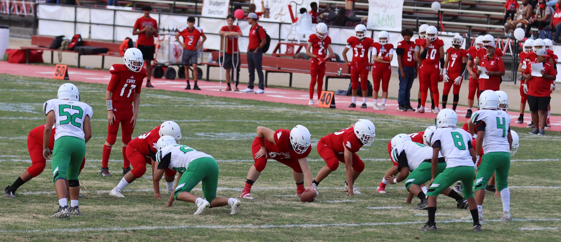  junior varsity football players in action against riverdale