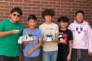 Ridgewood Elementary Storm Chaser pose with creations and models
