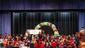 First grade students sing at an assembly