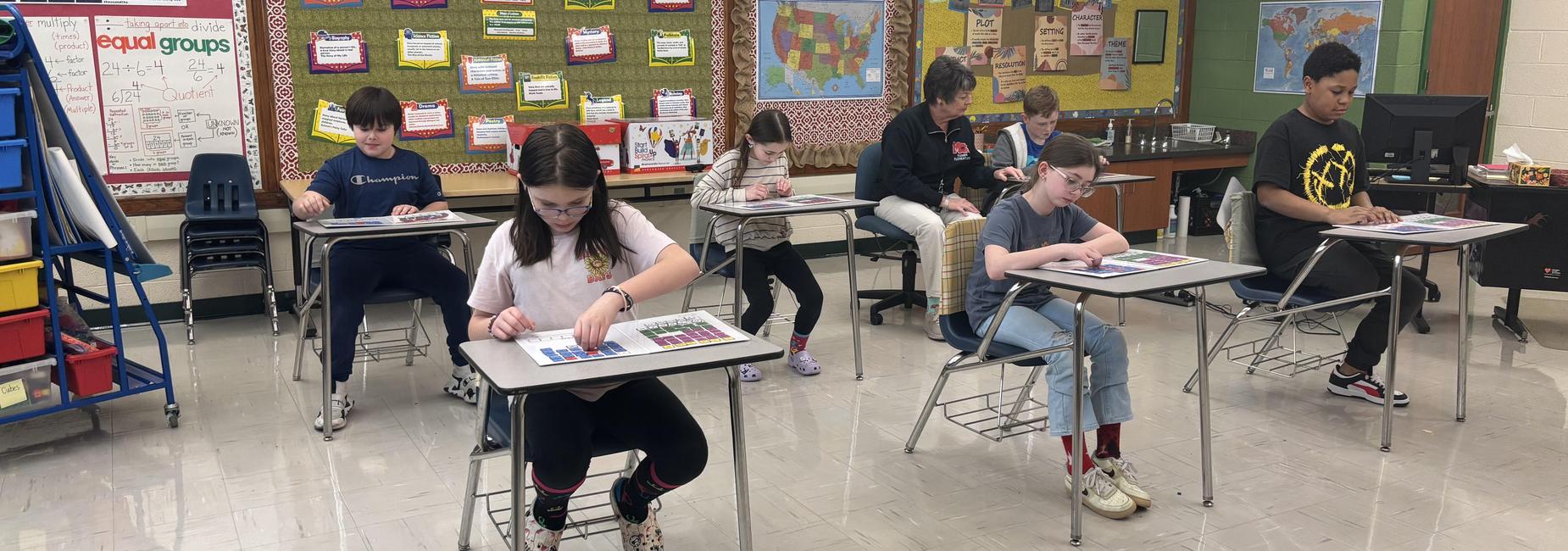 Students sitting at desks learning
