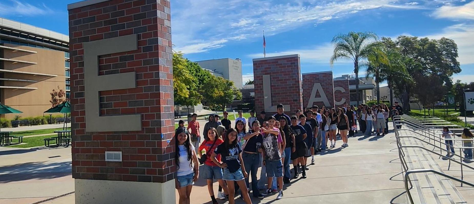 students In front of ELAC letters.