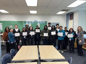 PROMISE students post with School Committee certificates recognizing their achievement
