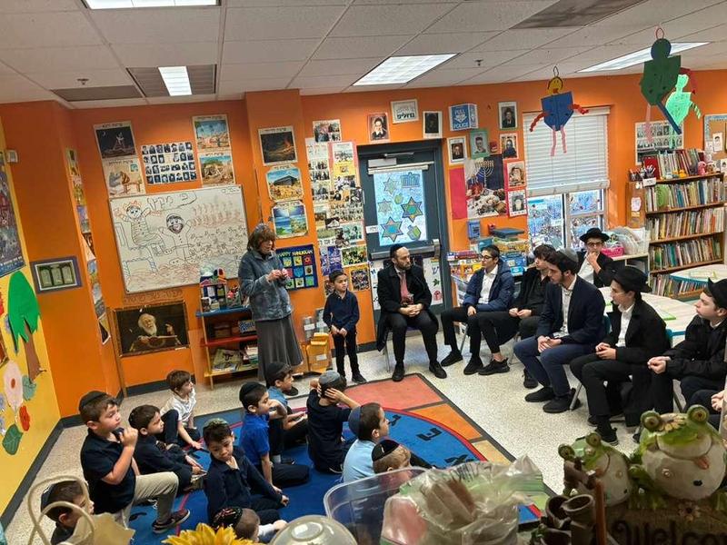 The kindergarten boys welcome the 9th grade class from YOY.