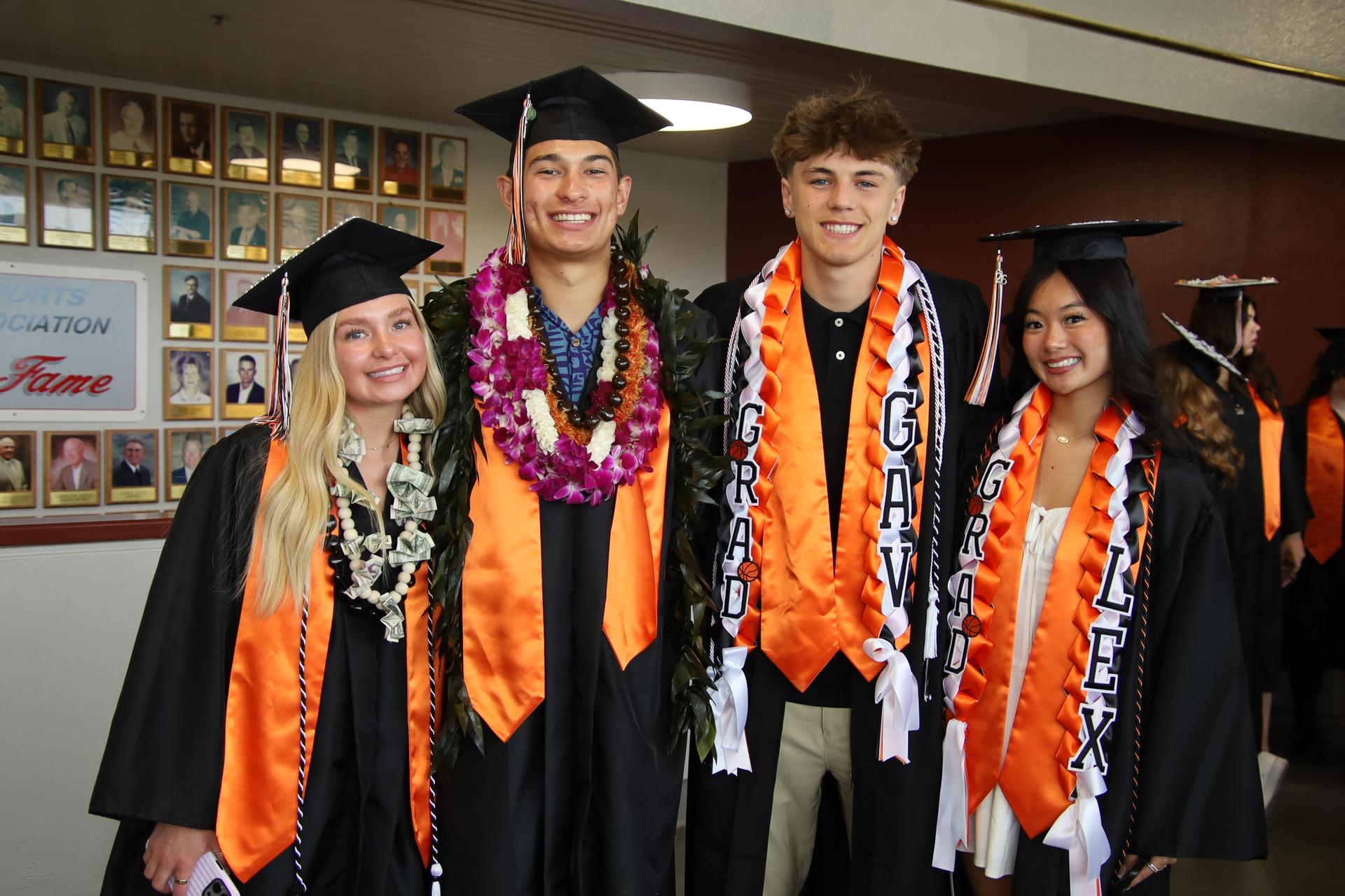 Students smiling at graduation ceremony