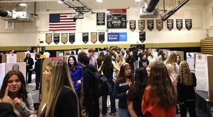 Overview of gym with students and senior projects