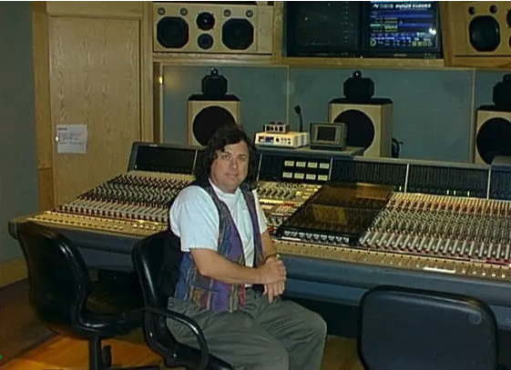 Picture of Brian McCarty next to sound board