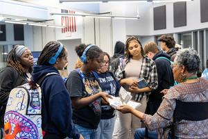 Sharon Flake signs books for the students