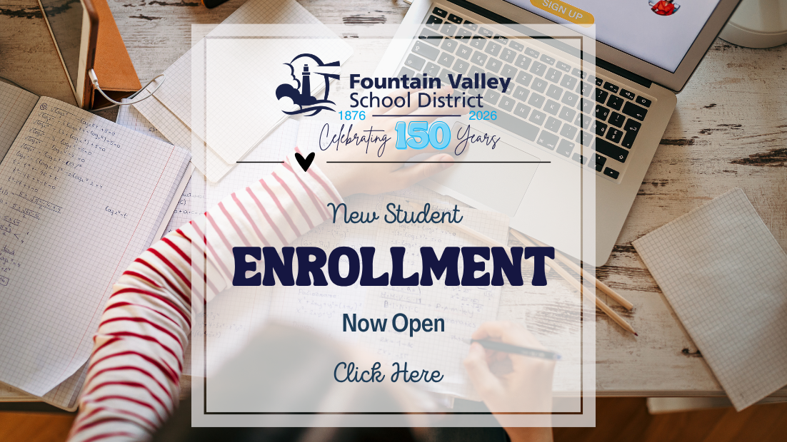 A desk with a laptop, notebooks, and an announcement about new student enrollment.