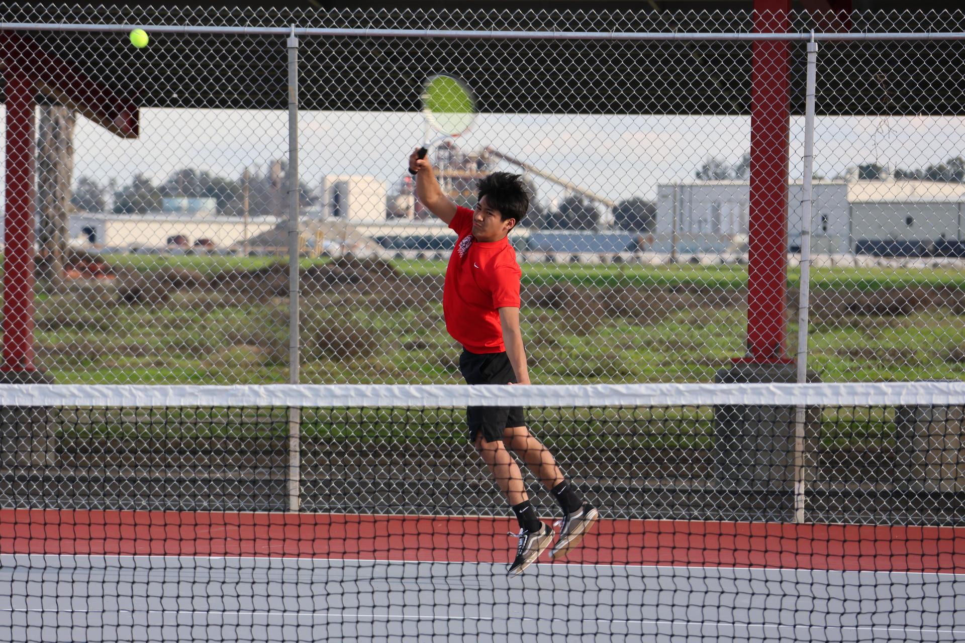 CUHS Boys playing tennis against coalinga