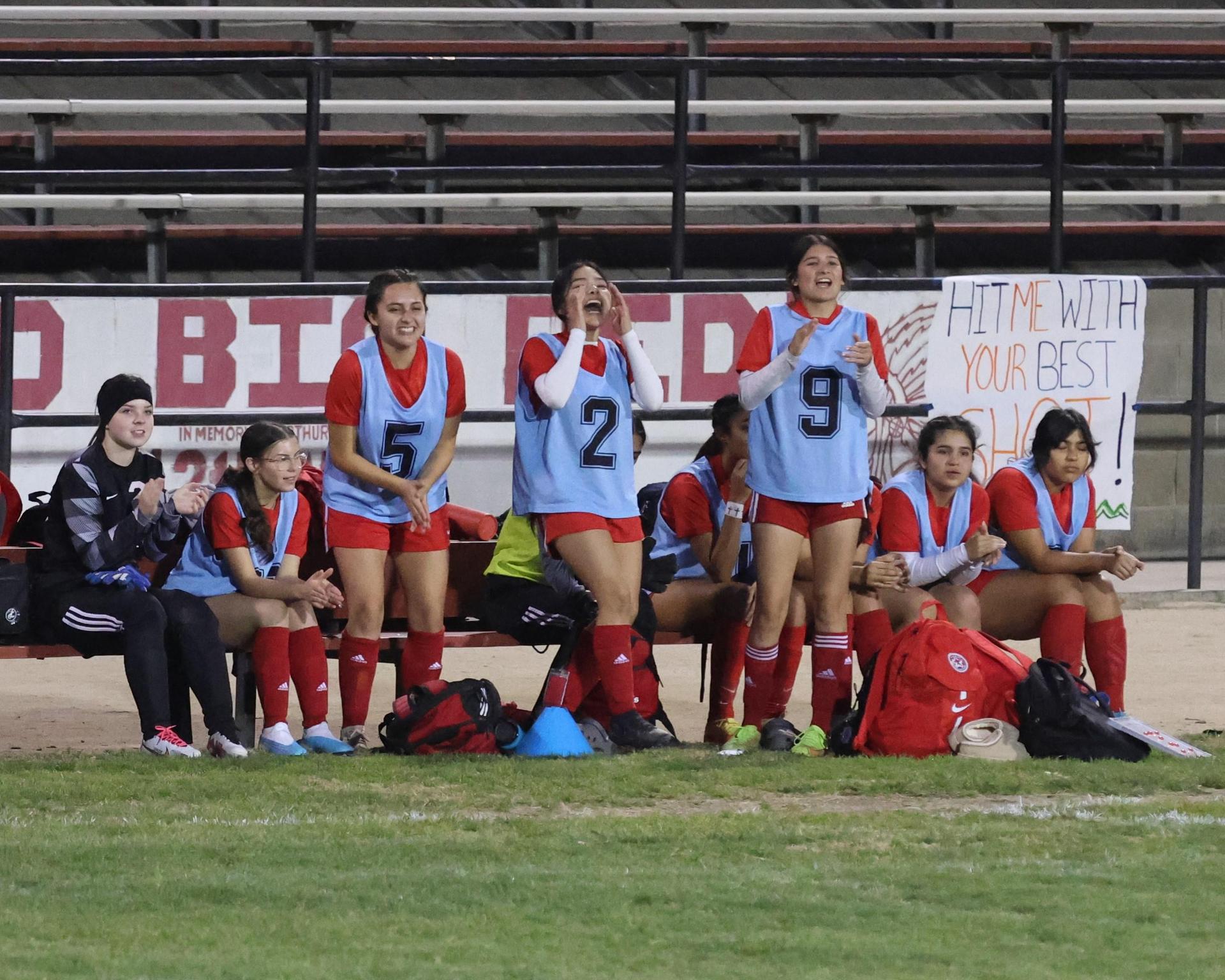 Varsity girls playing soccer against sunnyside