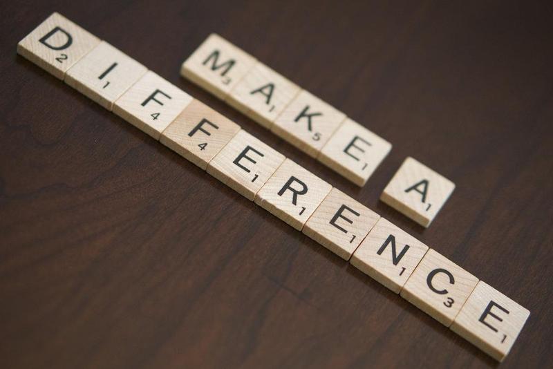 Scrabble tiles laid out to spell Make a Difference