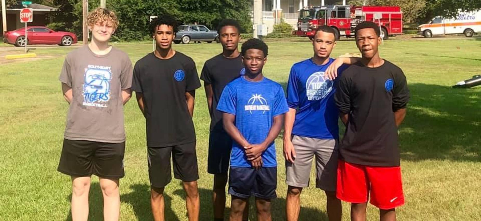 Basketball players volunteering in the community.