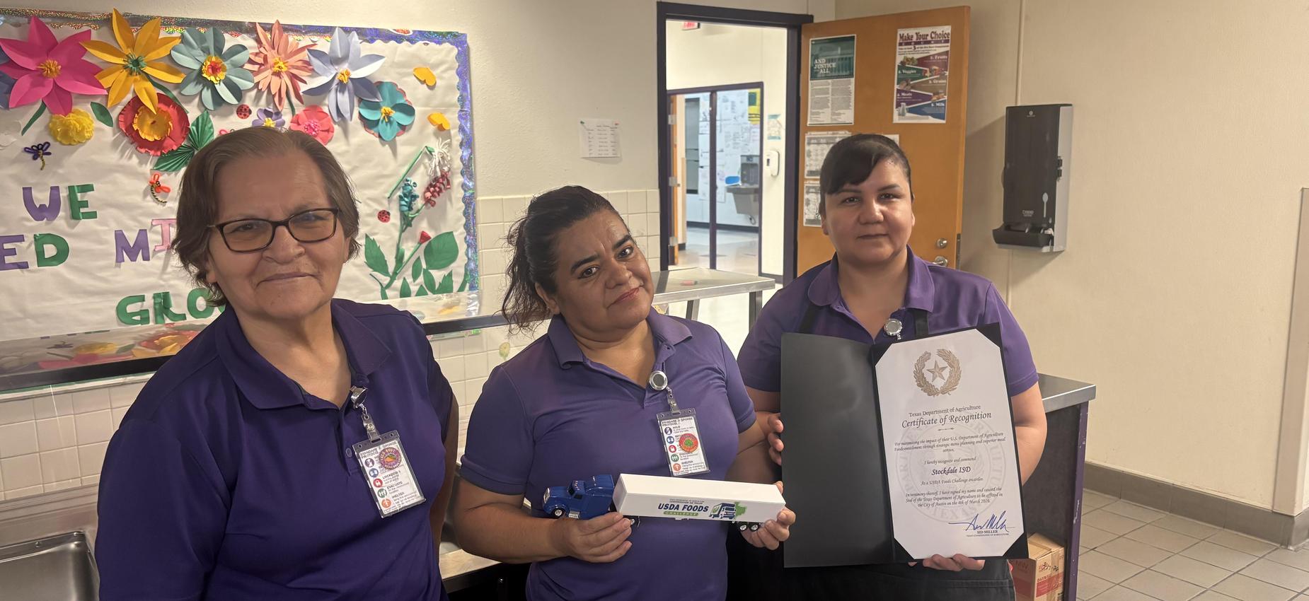 Our cafeteria workers were awarded the USDA Food Challenge award.  Here are three of our staff members holding the award.