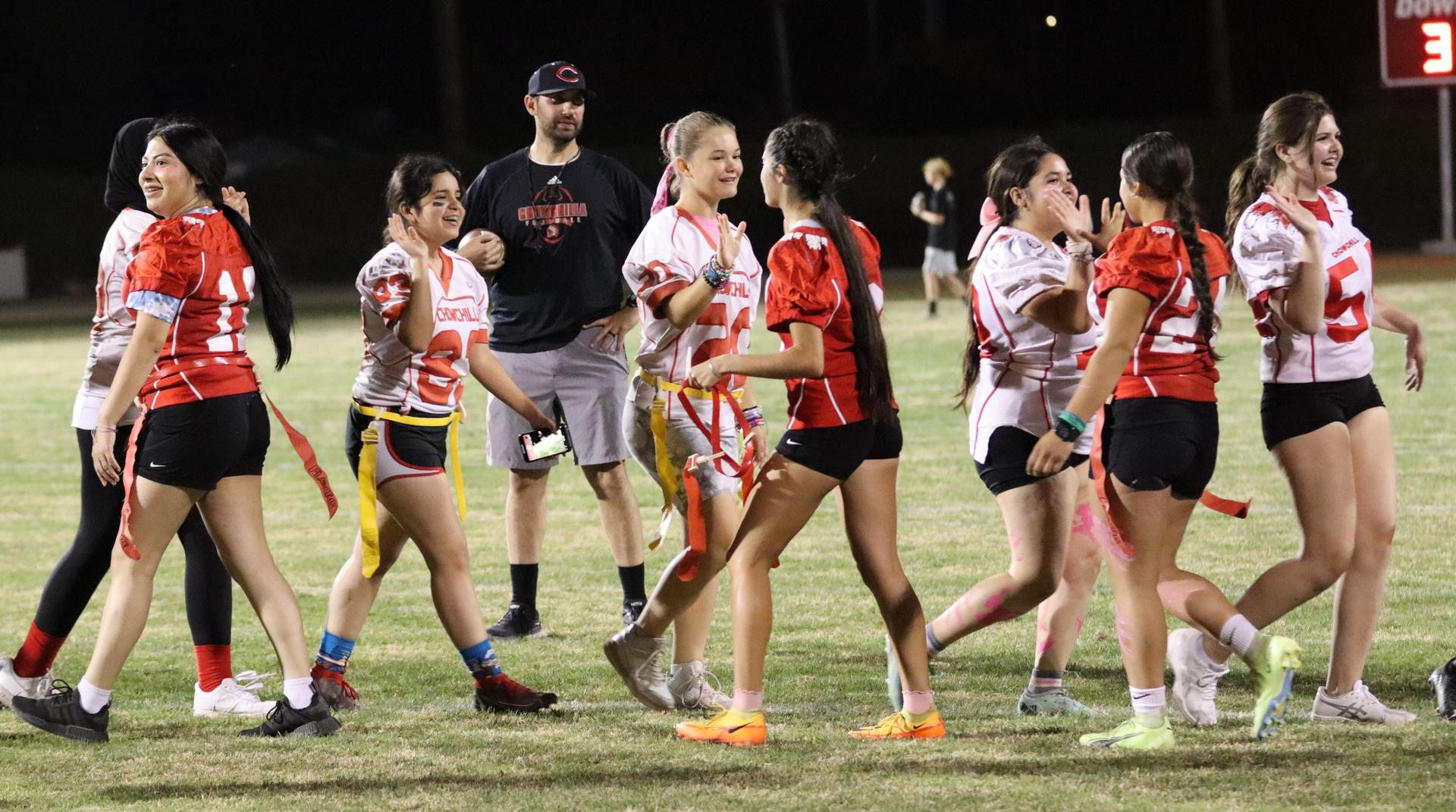 students shaking hands after the game