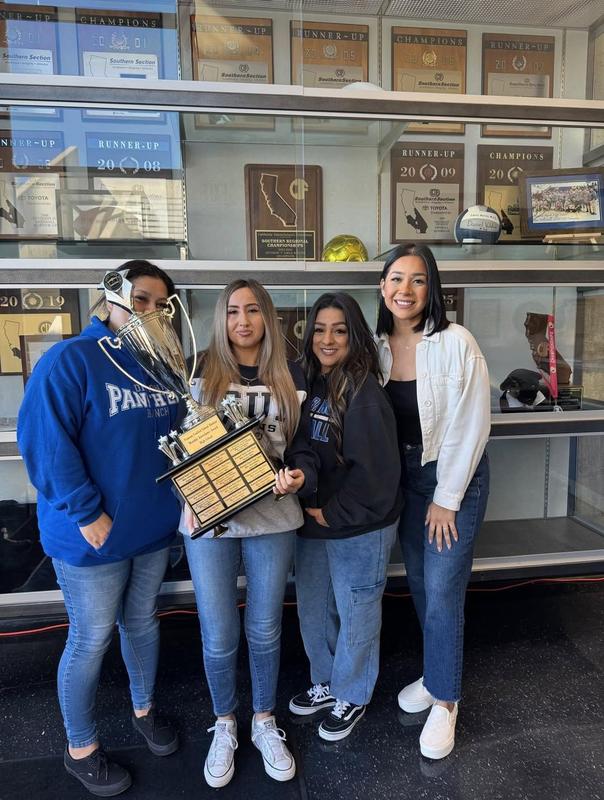 DRHS staff holding trophy