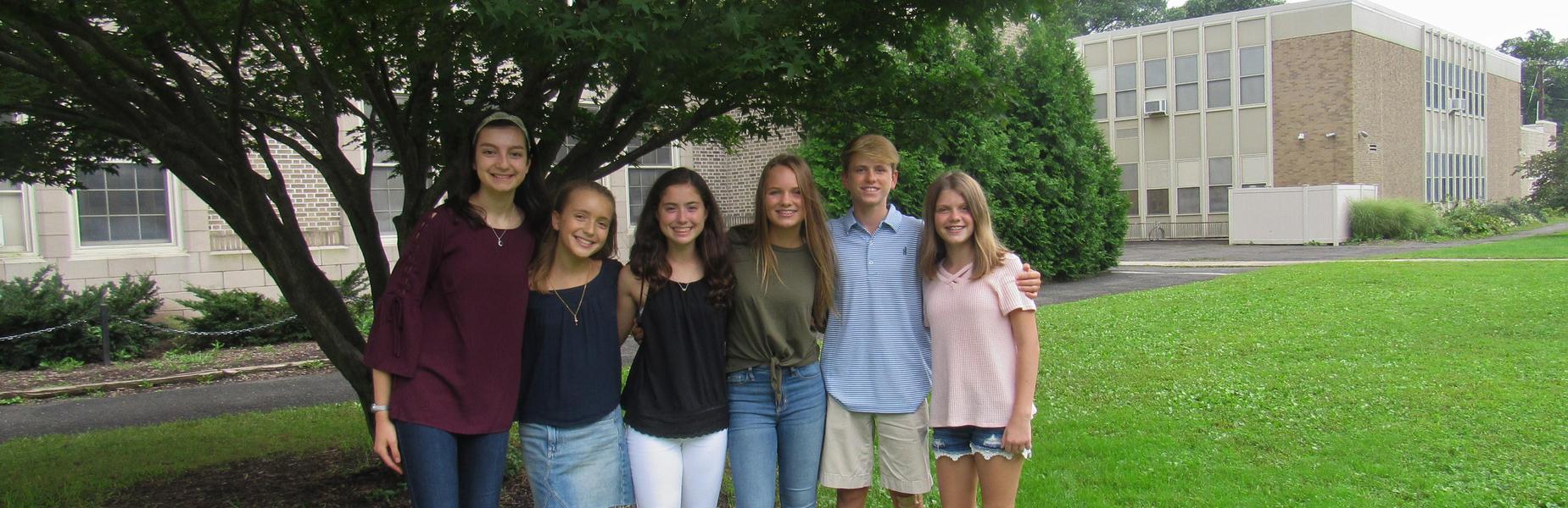 Members of the Roosevelt Intermediate School student council pose for a picture outside of the school.