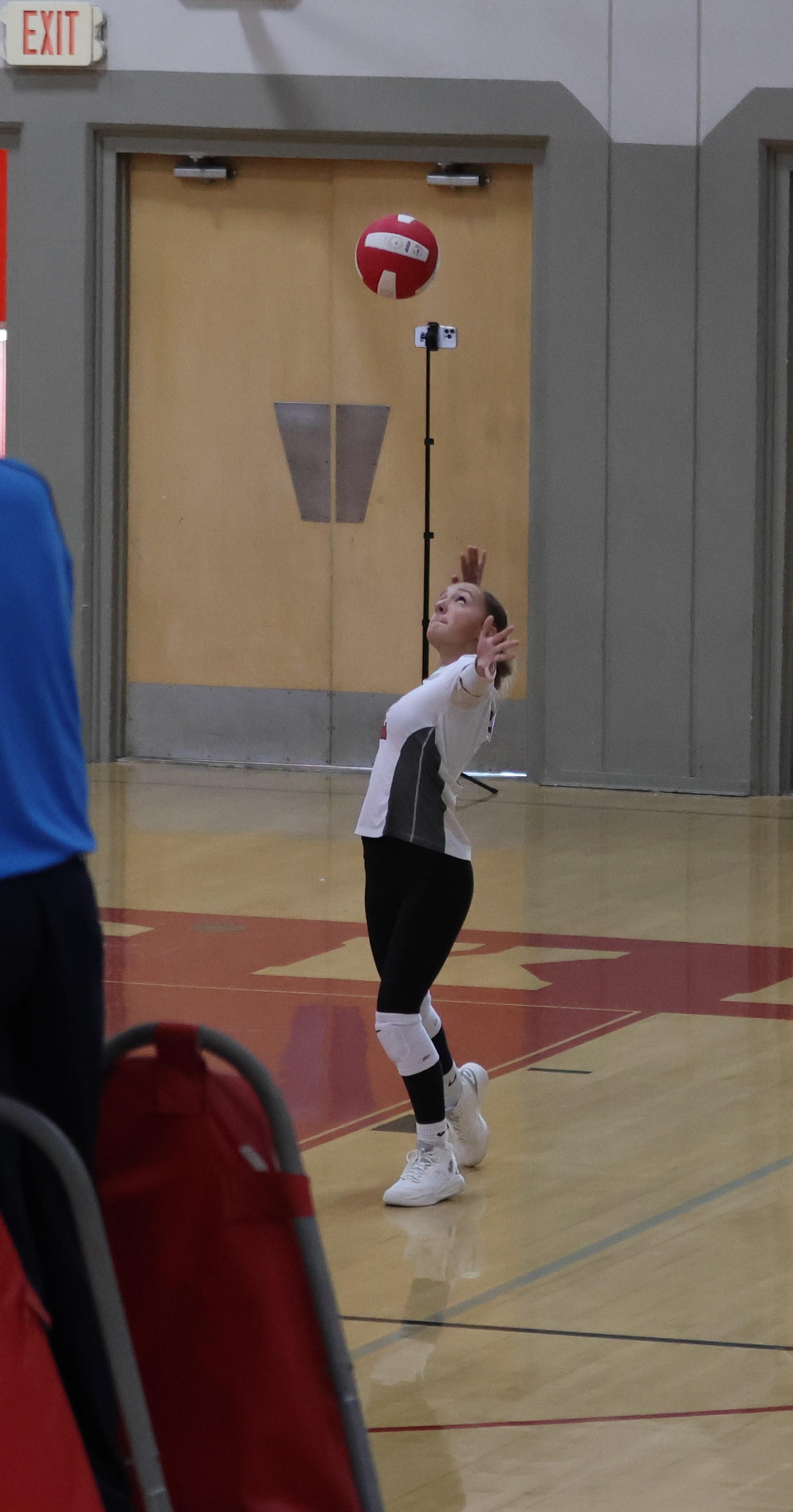 junior varsity girls playing volleyball 97